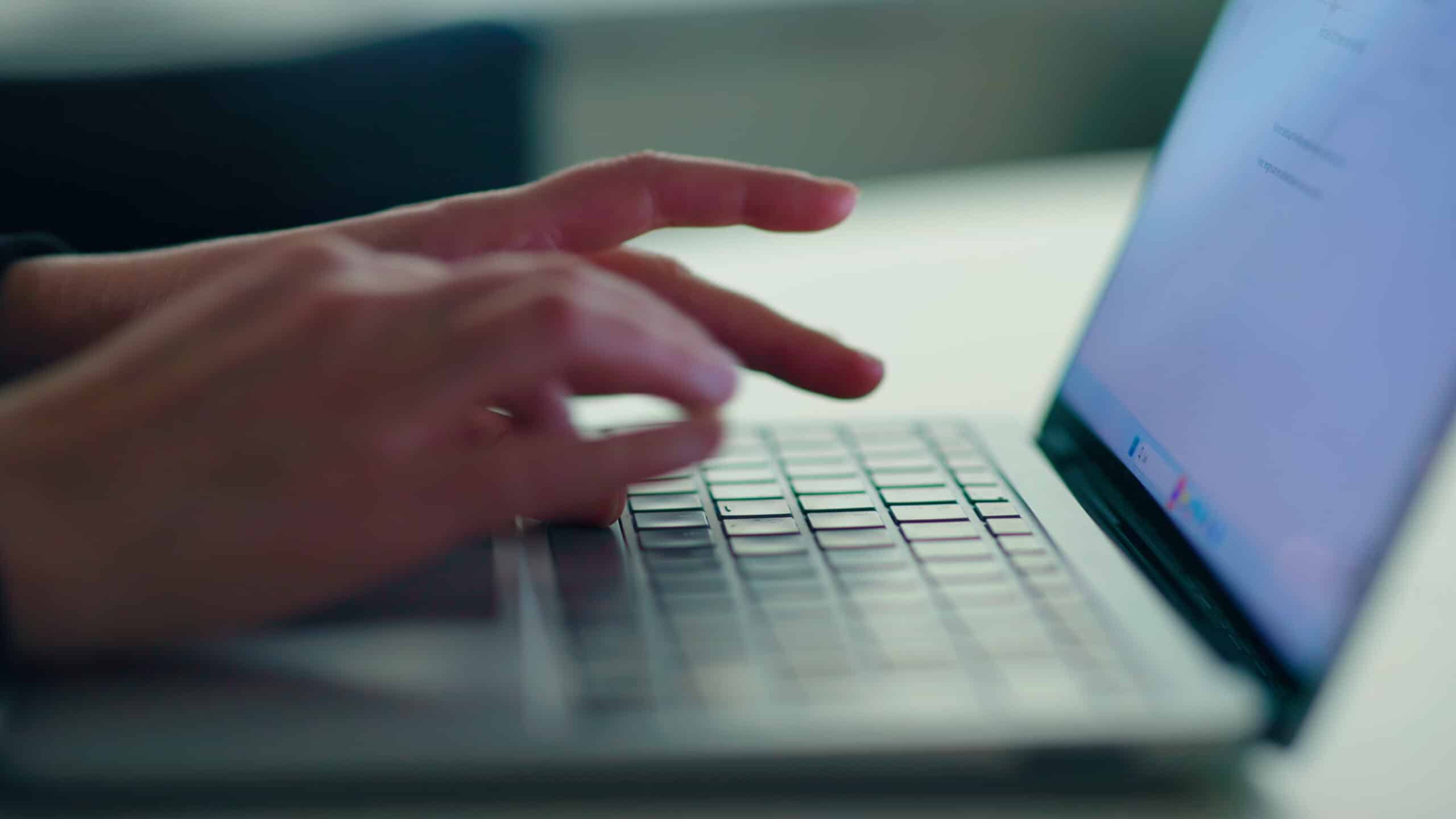 person typing computer