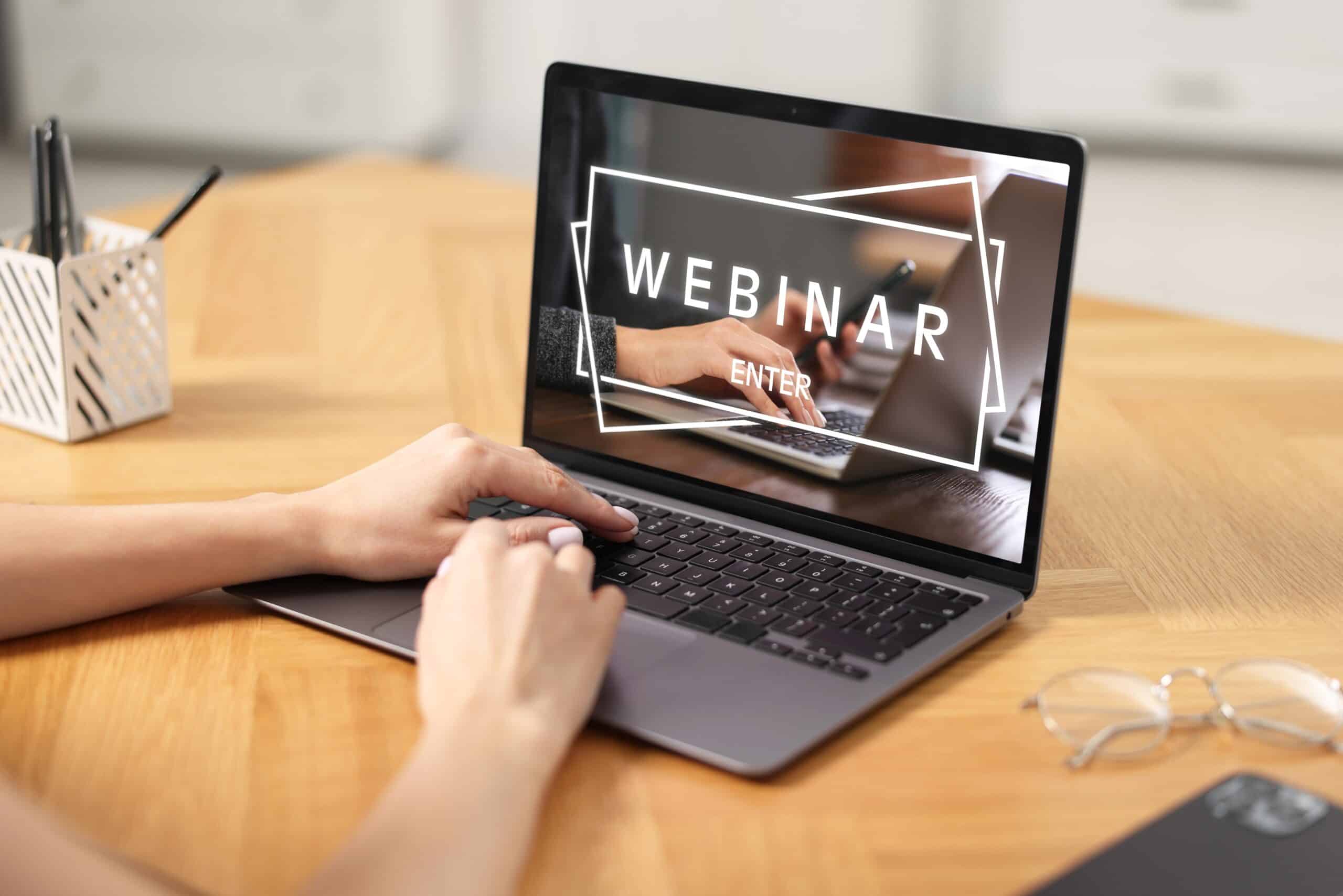 Webinar.,Woman,Using,Laptop,At,Table,,Closeup